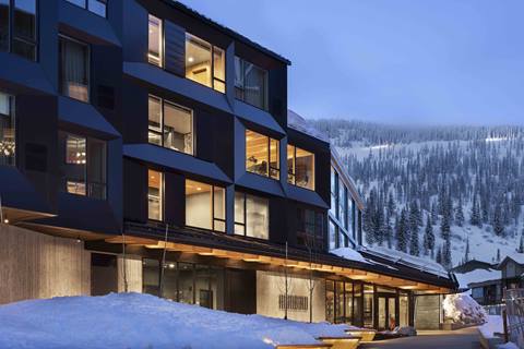 humbird hotel exterior at night at schweitzer mountain