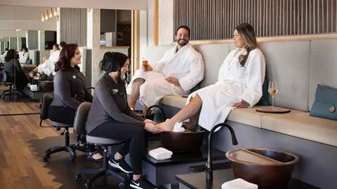 Couples enjoying foot treatments in robes at cambium spa at Schweitzer