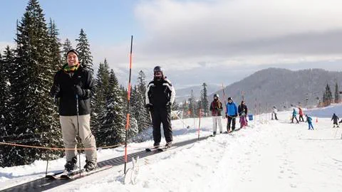 First day skiing. Skier riding the Musical Carpet at Schweitzer. 