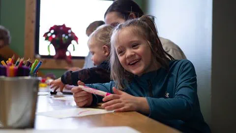 Young kids enjoying arts and crafts time at Schweitzer's childcare program