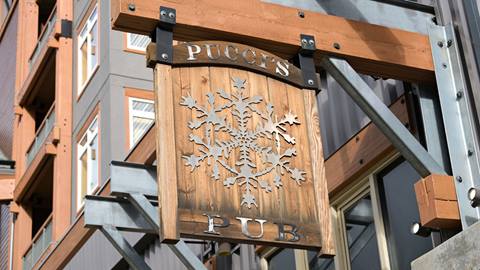 Sign hanging outside Pucci's Bar at Schweitzer
