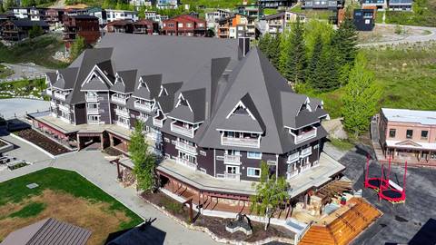 Aerial view of the Selkirk Lodge condos at Schweitzer with alpine architecture and Village access