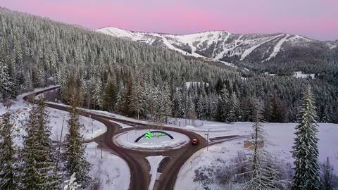 drone image of the arch before arriving at Schweitzer with pink sunrise skies