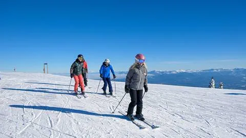 guests at schweitzer learning new techniques during ski lessons on wide open snow covered slopes