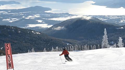 skier on demo ski rentals skiing at schweitzer mountain resort