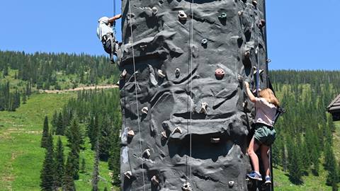 kids rock climbing at schweitzer during the summer